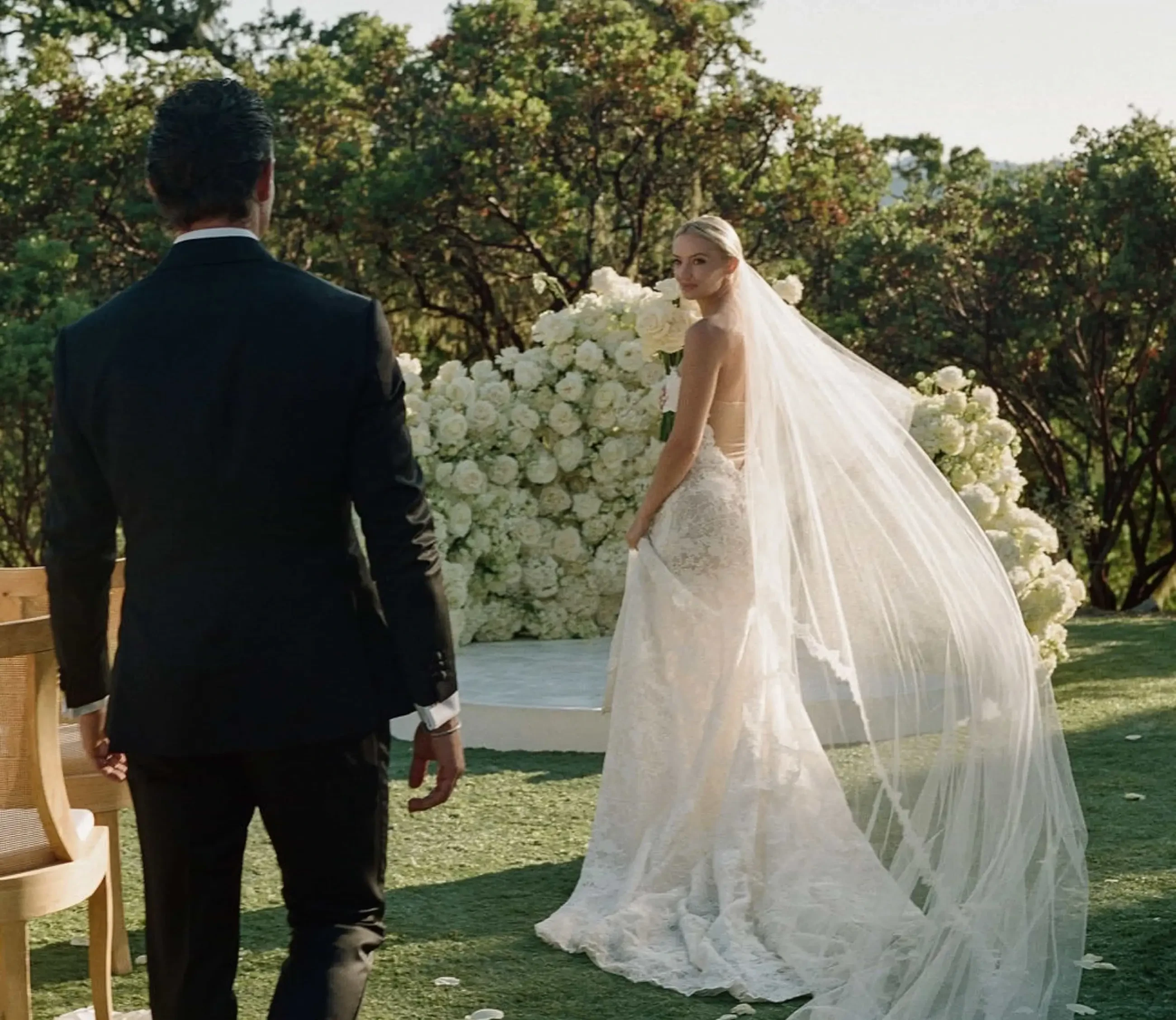 image shows a bride and groom looking at each other
